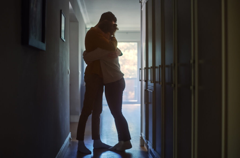 Two people hugging to show support for each other during grief.